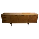 A McIntosh teak sideboard, circa 1950s, three cupboards and three drawers, each with lip handles,