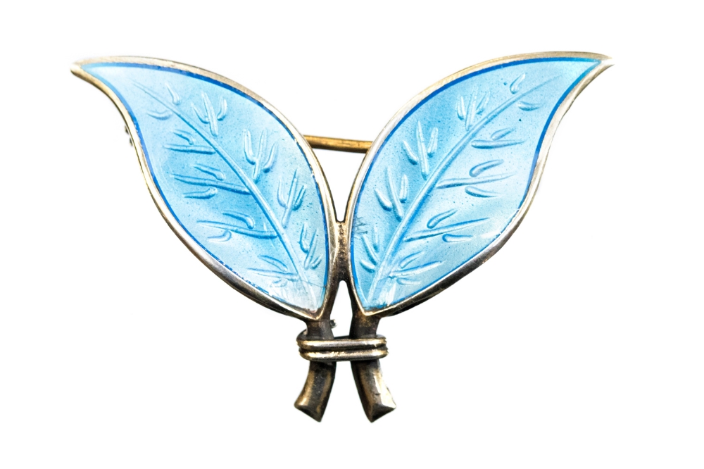 Willy Winnaess for David Anderson, a Norwegian silver gilt and enamelled double leaf brooch,