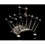 Christopher Dresser for Hukin and Heath, a silver plated letter or toast rack, circa 1881,