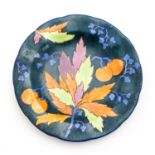 Carlton Ware Handicraft plate, decorated with fruit and leaves in a matte glaze,