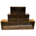 An Art Deco three section graduated stacking bookcase, each glazed unit with sliding doors,