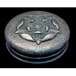 An Arts and Crafts silver powder box, circular form,