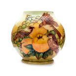 Sally Tuffin for Moorcroft, 'Finches and Fruit' vase, squat baluster form tubelined on ochre ground,