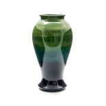 Walter Moorcroft for Moorcroft, a polychrome baluster vase, green draining to dark teal,