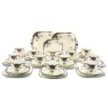 A Shelley Black Leafy Tree tea set, on Queen Anne shape, including 11 cups, saucers, plates,