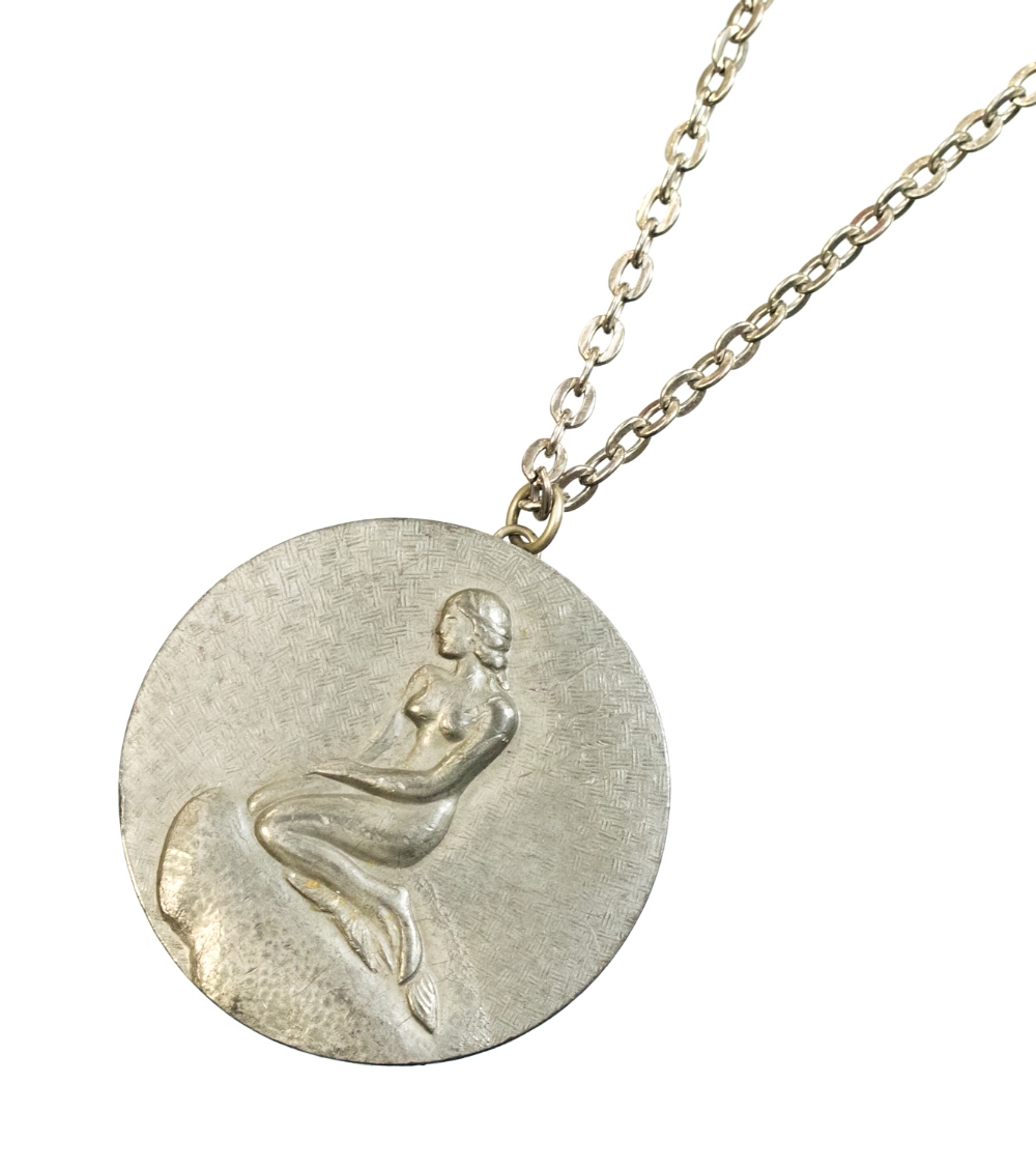 Jorgen Jensen, a Danish pewter pendant on chain, relief moulded Copenhagen Little Mermaid on a rock,