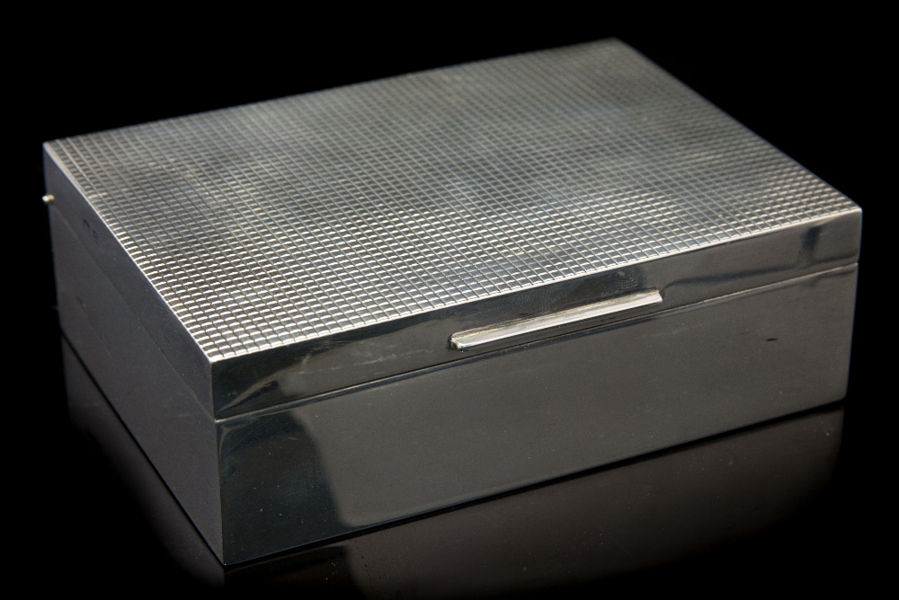 A Modernist silver cigarette box, cuboid form with incised cheque top, cedar lined to the interior,