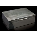 A Modernist silver cigarette box, cuboid form with incised cheque top, cedar lined to the interior,