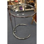 Eileen Gray, an E1027 chrome and glass side table, designed 1927, height adjustable, 51cm diameter,