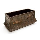 A Bretby Art Pottery flower trough, moulded with stylised flower head design on a textured ground,