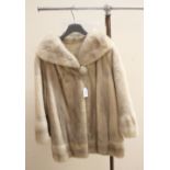 A cream natural Mink three quarter coat (1976) American market,