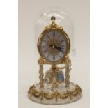 A vintage Franklin Mint German-manufactured glass-dome skeleton clock,