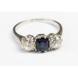 A sapphire and diamond three stone platinum ring,