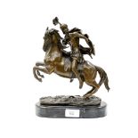After Guillaume Coustou, A Bronze model of a rearing Horse and rider, marble plinth base.