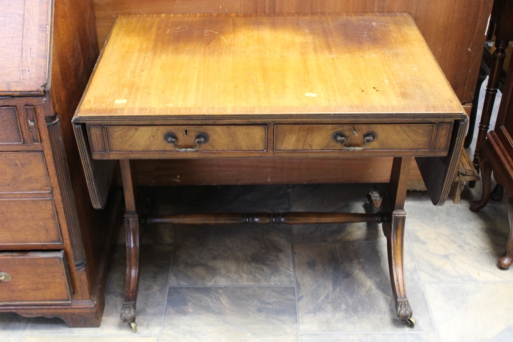 Two early 20th Century oak stools, with woolwork seats,