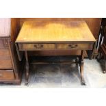 Two early 20th Century oak stools, with woolwork seats,