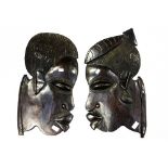 Two West African carved wood face wall plaques (2)