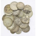 A collection of pre 1920s silver coins to include: florins, crowns, rubbed coins and others various,