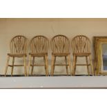 A set of four solid beech Windsor style chairs (4)