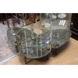A 1960s three piece glass coffee table, two tiered,