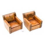 A pair of cigarette boxes, in the form of miniature leather Begere chairs,