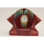 An Art Deco glazed pottery bracket clock of fan design