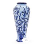 A Moorcroft vase having blue Daffodil pattern on blue ground, signed and dated 2003 to base,