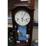 A mahogany drop dial wall clock by Kieninger,