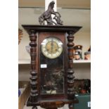 A late 19th Century eight day walnut and beech cased wall clock, Roman numerals, pendulum, complete,