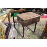 A school desk and integral chair.