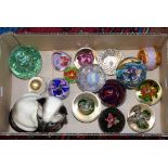 A collection of various paperweights.