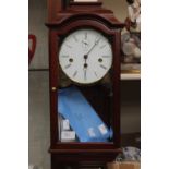 A mahogany drop dial wall clock by Kieninger with pendulum and key,