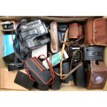 A box containing a collection of various cameras, mostly mid 20th Century and later,