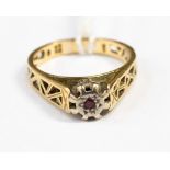 An 18ct gold ring, illusion set with a small ruby, size Q, gross weight approx 5.