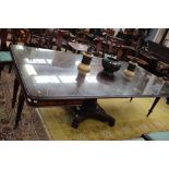 A large Victorian mahogany dining table, fitted with three removable leaves,