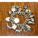 A silver charm braclet, 18 charms, total gross weight approx 95.