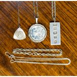 Five items of silver jewellery comprising a silver locket and chain,