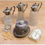 Three silver plated topped decanters, a silver plated tea caddy on stand, ivorine bible,