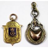 Football Medals: A 9ct gold, shield-shaped football medallion,