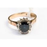 An sapphire and diamond 18ct gold cluster ring,