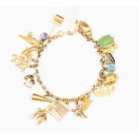 A 9ct gold charm bracelet containing assorted 9ct gold charms approx 29.