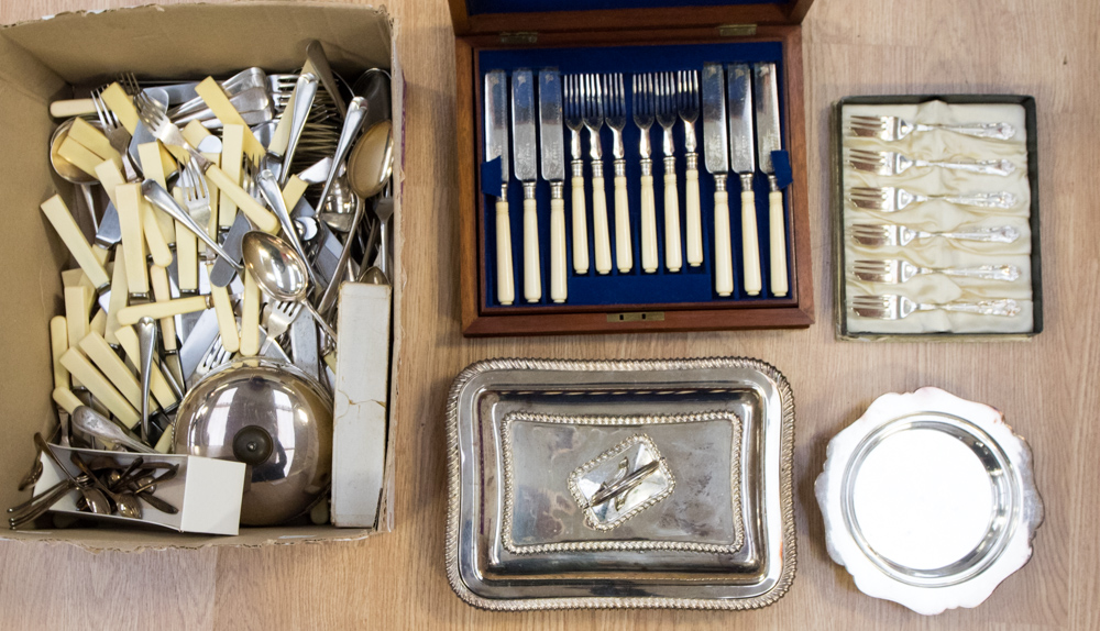 A box of platedwares to include cutlery and flatware