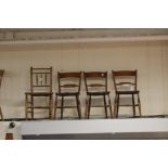 Three early Victorian Elm and Beech kitchen chairs;
