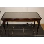 A Regency style 1970's coffee table with glass top