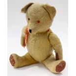 A circa 1950s golden plush Teddy bear