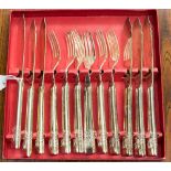 A cased set of fish knives and forks,