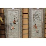 A pair of Chinese silk embroidered panels, depicting figures in a garden setting,