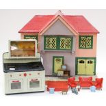 A mid 20th Century dolls house in the style of a 1920s mock Tudor house,