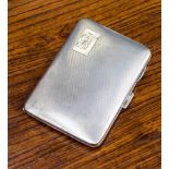 An Edward VIII ladies silver cigarette case with gilt interior and spring strap,