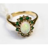 An opal, diamond and emerald 9ct yellow gold cluster ring, ring size L,